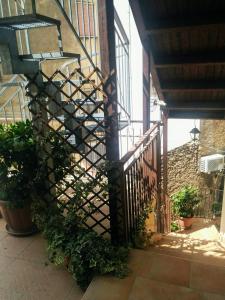 a stairway with a wrought iron gate and plants at Casa Delle Rose in Capaccio-Paestum