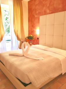 A bed or beds in a room at Residenza Eden