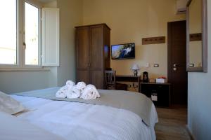 Postel nebo postele na pokoji v ubytování EOS Room and Breakfast