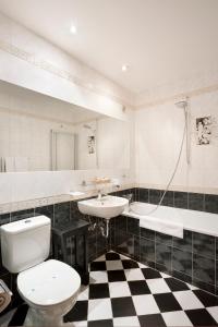 A bathroom at Hotel U Zlatého Stromu Prague by BHG