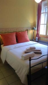 Кровать или кровати в номере Le Moulin de l'Abbé