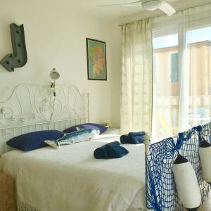 Postel nebo postele na pokoji v ubytování B&B Il Tentacolo