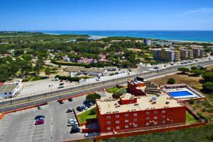 an aerial view of a city with the ocean at Zodiaco in Quarteira