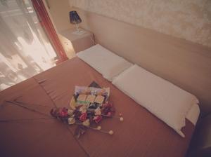 Postel nebo postele na pokoji v ubytování Cassiodoro Rooms Affittacamere
