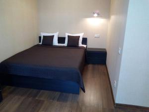 Postel nebo postele na pokoji v ubytování Dvoryanskiy Hotel