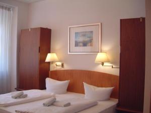 Posteľ alebo postele v izbe v ubytovaní Hotel Toscana