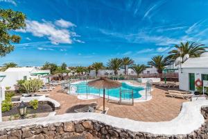 a view of the pool at the resort at Apartamentos LIVVO Las Gaviotas in Puerto del Carmen
