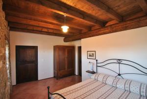 Giường trong phòng chung tại Ospitalita' Rurale Casa Cani