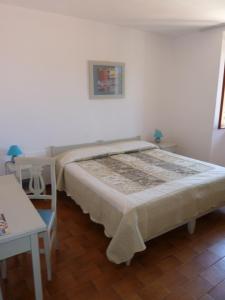 Voodi või voodid majutusasutuse Albergo Dei 10 Colori toas