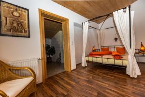 a bedroom with a bed with a canopy at Haus Alpenblick in Ehrwald