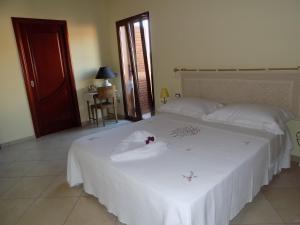 A bed or beds in a room at Al Ciclamino