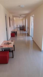 an empty room with tables and chairs in a building at Pensiunea Driver in Orăştie