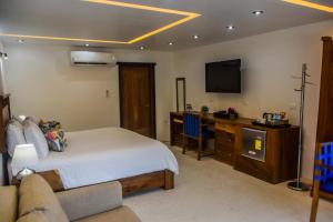 TV a/nebo společenská místnost v ubytování El Paraiso Hotel Tulum