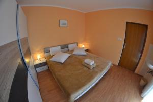 מיטה או מיטות בחדר ב-Apartman Jadranka