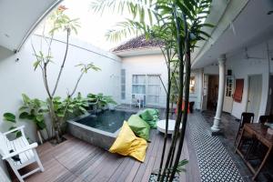 a room with a pool with a stuffed animal in the middle at The Patio Yogya in Yogyakarta