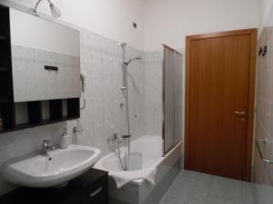 a bathroom with a sink and a shower and a tub at Acquamarina B&B in Martinsicuro +23 photos