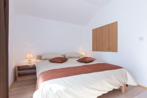 Postel nebo postele na pokoji v ubytování Apartman Ivona