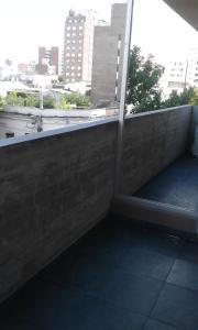 a balcony with a view of a city at Pueyrredon 1101 in Rosario