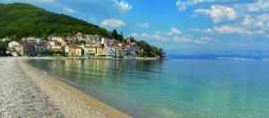 a town on the shore of a body of water at Apartment D&J in Mošćenička Draga