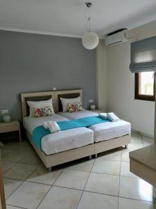 a bedroom with a large bed in a room at Villa Dimitris in Parga +29 photos