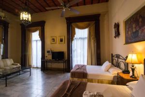 Postel nebo postele na pokoji v ubytování El Gran Hotel + 37 fotografií