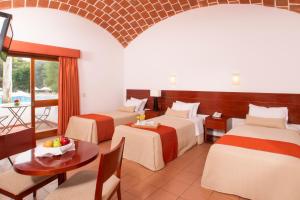 Postel nebo postele na pokoji v ubytování Hotel Las Dunas