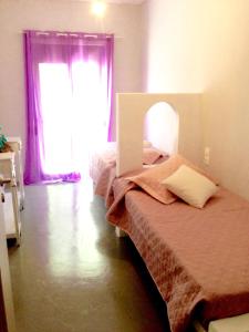 Postel nebo postele na pokoji v ubytování Heraklion Gortyn Phaistos House