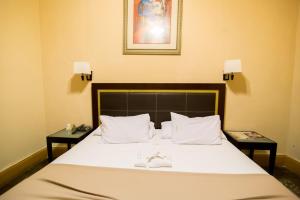 Postel nebo postele na pokoji v ubytování El Gran Hotel