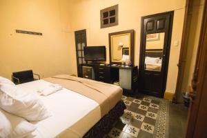 Postel nebo postele na pokoji v ubytování El Gran Hotel