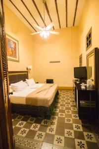 Postel nebo postele na pokoji v ubytování El Gran Hotel