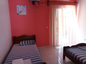 מיטה או מיטות בחדר ב-Georgoulas Apartments