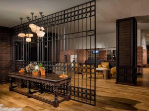 a room with a table and a black fence at Hotel Valencia Riverwalk in San Antonio