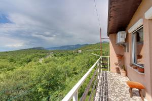 a balcony with a view of a mountain at Rajski vrt in Crikvenica