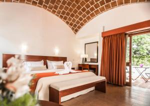 Postel nebo postele na pokoji v ubytování Hotel Las Dunas