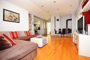 a living room with a couch and a table at Apartments Andreja in Kožino
