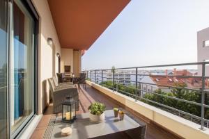 a balcony with a table and a view of the city at Skyline View in Lagos
