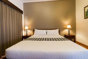 Postel nebo postele na pokoji v ubytování Vidi Boutique Hotel
