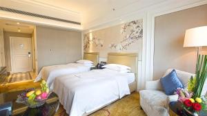 Ένα ή περισσότερα κρεβάτια σε δωμάτιο στο Shenzhen Dayhello international Hotel (Baoan)