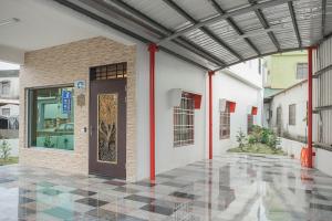 a entrance to a building with a door at 佳家民宿 in Linbian