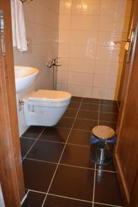 a bathroom with a toilet and a sink at Osmanli Marco Pasha Hotel in Tarsus +48 photos