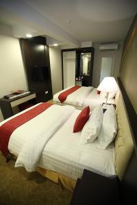 Postel nebo postele na pokoji v ubytování Al Khatiri Hotel