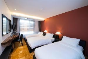 Postel nebo postele na pokoji v ubytování Hotel Leo