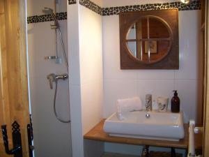 a bathroom with a sink and a shower at Chalet Odette in Morzine +22 photos
