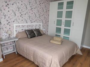 Posteľ alebo postele v izbe v ubytovaní DREAMSUITES MARIN GARCIA.