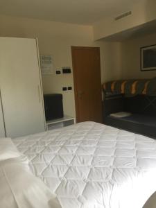 Postel nebo postele na pokoji v ubytování Hotel Consuelo