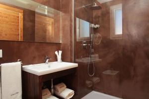 a bathroom with a sink and a shower at Rivazzurra Design Rooms in San Vito lo Capo +89 photos