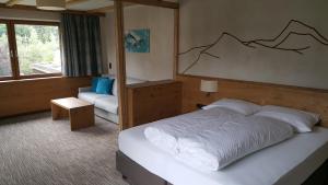 Postel nebo postele na pokoji v ubytování Hotel Mozart