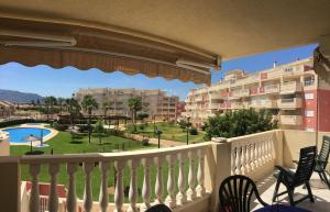 a balcony with a view of a park and buildings at Playa Sol Denia Mediterranea-Serviden in Denia