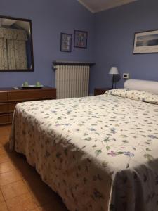 Postel nebo postele na pokoji v ubytování Corte Posta B&B - parcheggio e bagno in camera