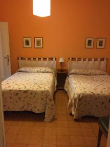 Postel nebo postele na pokoji v ubytování Corte Posta B&B - parcheggio e bagno in camera